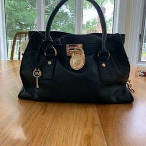 Michael Kors black leather hand bag.